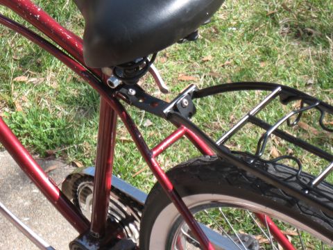 1994 Ford Bronco - Rear section of a bicycle showing the seat, frame, and cargo rack.