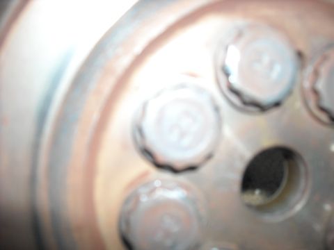 1979 Ford F-150 - Lug nuts are visible on a wheel hub in this close-up shot.