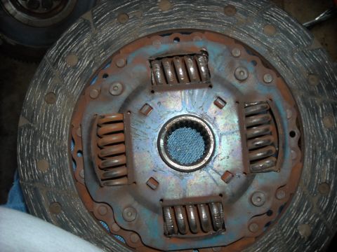 1979 Ford F-150 - A worn clutch disc with visible springs and a central splined hub is shown.
