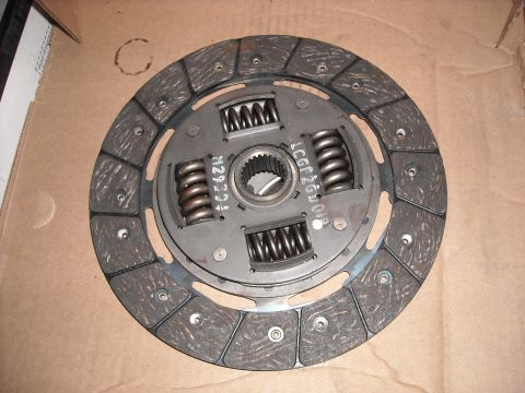 1979 Ford F-150 - A clutch disc is shown in a cardboard box, with visible part numbers and springs.