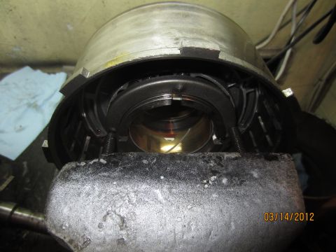 1979 Ford Bronco - Transmission part being worked on, held securely in a vise for repair.