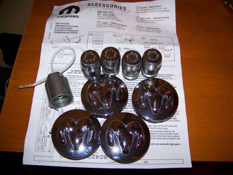 2000 Jeep Wrangler - Mopar accessories, including wheel locks and Ram logo center caps, are shown with their installation instructions.