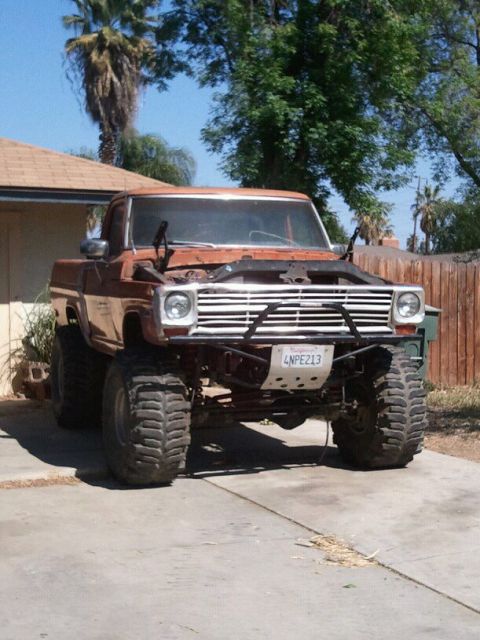 1969 Ford F-250 - This heavily modified pickup truck features oversized tires and a custom front bumper, suggesting a build from the 1970s.