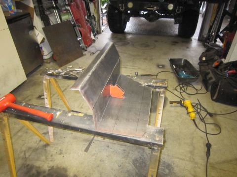 2008 Jeep Wrangler - Metal fabrication project in progress, with tools and a vehicle visible in the garage.