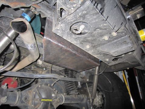 2008 Jeep Wrangler - Custom metal fabrication is visible on the undercarriage, near the exhaust pipe and rear axle assembly.