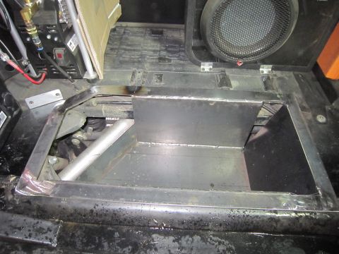 2008 Jeep Wrangler - Custom metal storage box installed in the floor of a vehicle, with a speaker mounted above.