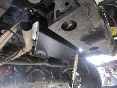2008 Jeep Wrangler - The photo shows the undercarriage of a vehicle, focusing on the suspension and exhaust components.