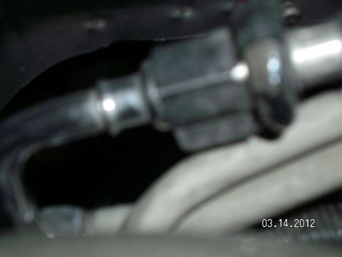 1996 Ford Bronco - Close-up of a fuel fitting, dated 03.14.2012, with a Supermotors.net watermark.