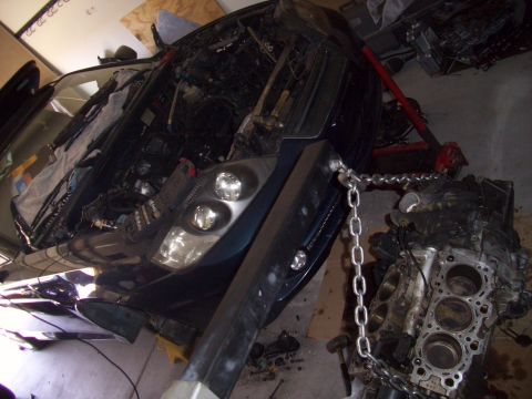 2003 Hyundai Tiburon - Engine removal in progress for a 2003 Hyundai Tiburon.