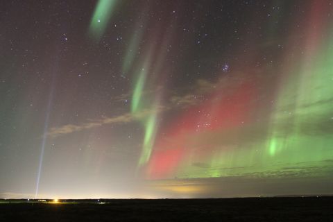 1970 Ford Mustang - Northern lights display with colorful bands of light in the night sky.