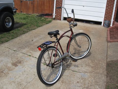 1994 Ford Bronco - A custom cruiser bicycle with a unique handlebar setup is parked on a concrete driveway.