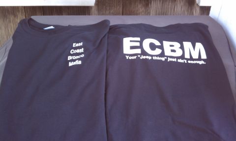 1979 Ford Bronco - Two t-shirts are shown, one with 'East Coast Bronco Mafia' and the other with 'ECBM' and a slogan about Jeeps.