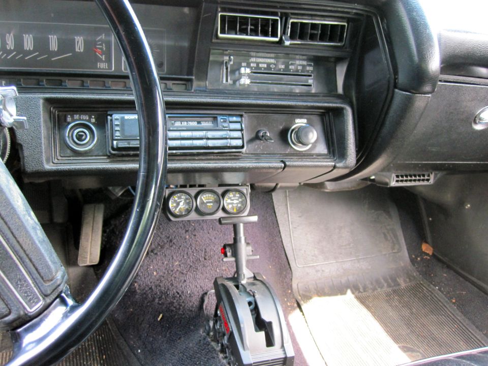 1971 Chevrolet Chevelle interior with aftermarket gauges and shifter
