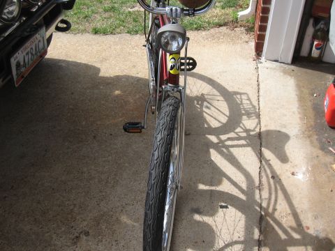 1994 Ford Bronco - A red bicycle with a Moon Eyes logo is parked in front of a garage.