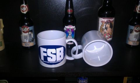 1989 Ford Bronco - Two white mugs the FSB logo and website are displayed among several beer bottles.