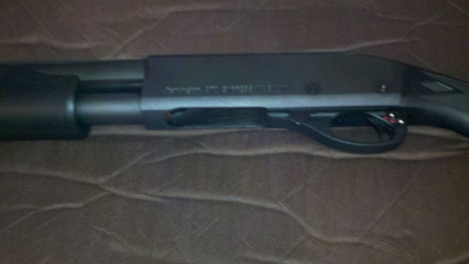 close-up of shotgun receiver and trigger assembly