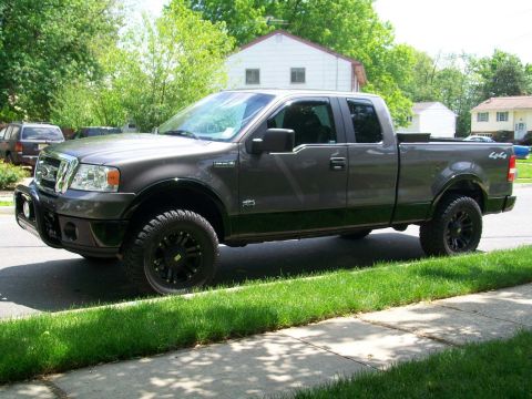 2008 Ford F-150 - This 2008 Ford F-150 pickup truck is shown in a 3/4 front view, aftermarket wheels and a bull bar.