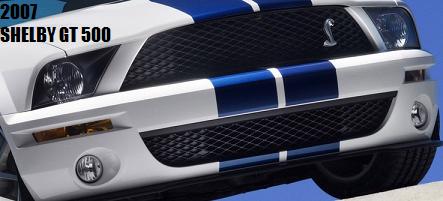 2007 Ford Mustang - Front view of a 2007 Ford Mustang Shelby GT500, showing its grille and headlights.