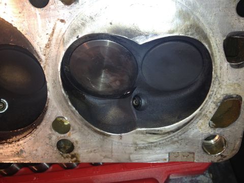 1992 Ford Bronco - Close-up view of an engine cylinder head, showing the intake and exhaust valves and combustion chambers.