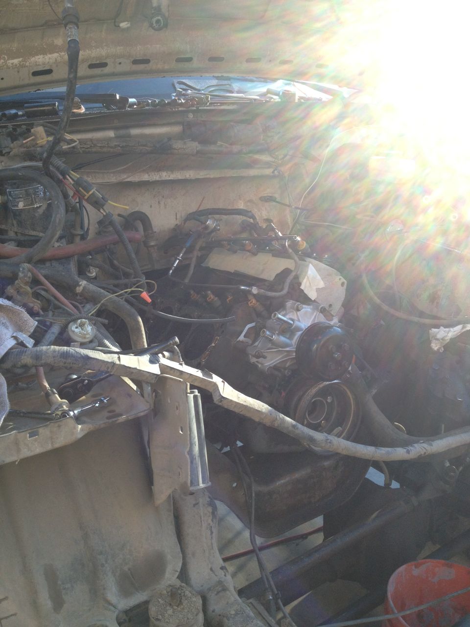 1992 Ford Bronco engine bay with exposed engine components and wiring