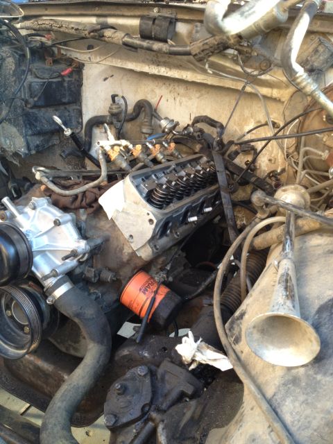 1992 Ford Bronco - Close-up view of an engine bay, showing various mechanical components and wiring.