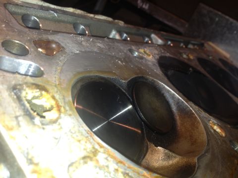 1992 Ford Bronco - Engine cylinder head showing valves and ports, likely during a rebuild or inspection.