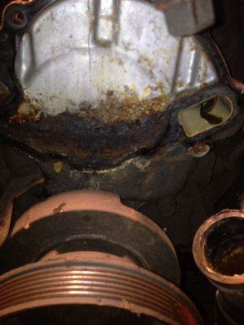 1992 Ford Bronco - Close-up of a corroded engine water pump, part of a motor rebuild.