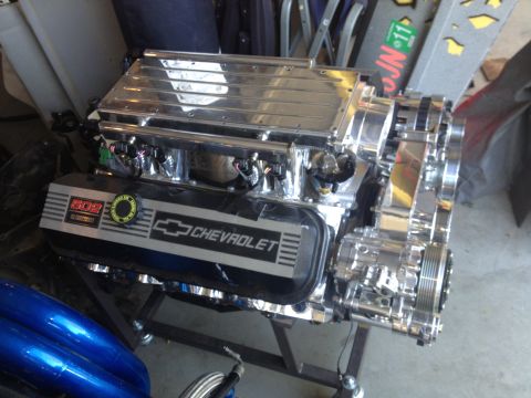 1992 Ford Bronco - A highly polished Chevrolet engine, identified as a 502, is displayed on a stand.