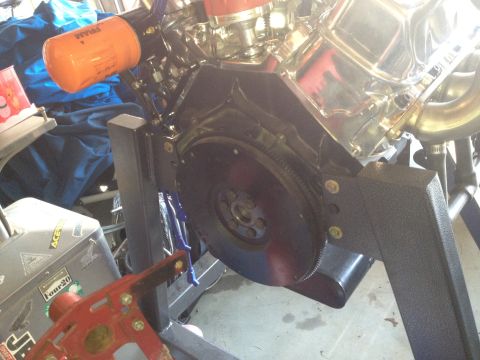 1992 Ford Bronco - Engine block with chrome valve covers and an orange Fram oil filter.