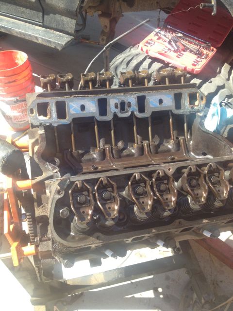 1992 Ford Bronco - Close-up view of an engine's internal components during a rebuild, with tools and supplies visible.