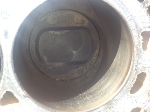 1992 Ford Bronco - This is a close-up view of an engine cylinder, showing wear and carbon deposits.