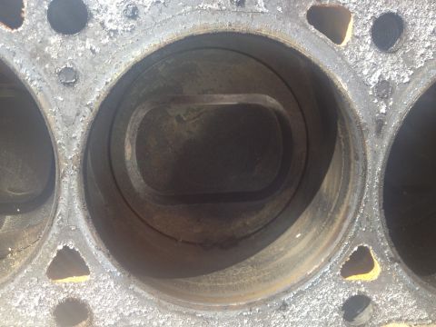 1992 Ford Bronco - Close-up view of corroded engine block cylinders, showing wear and tear.
