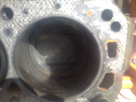 1992 Ford Bronco - Engine cylinder block showing wear and rust, likely from a motor rebuild project.