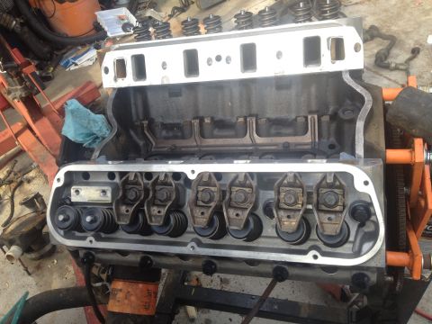 1992 Ford Bronco - Close-up view of an engine block with the valve covers removed, revealing the internal valve train components.