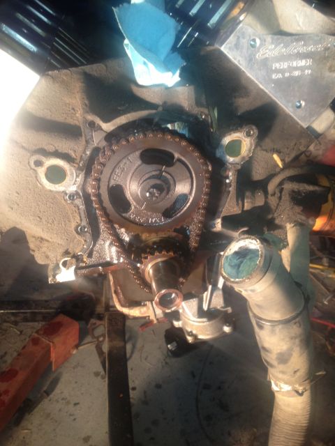 1992 Ford Bronco - Close-up of engine timing chain and gears, with an Edelbrock plate visible.