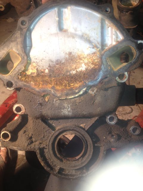 1992 Ford Bronco - A heavily corroded water pump housing is shown, indicating a need for replacement.