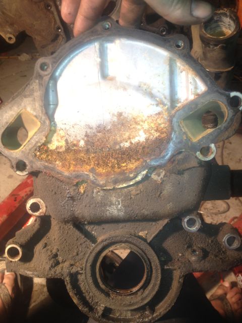 1992 Ford Bronco - This heavily corroded water pump is likely from a Ford Bronco, but its condition makes definitive identification difficult.