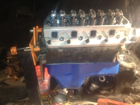 1992 Ford Bronco - Close-up view of an engine assembly, likely undergoing a rebuild or modification.
