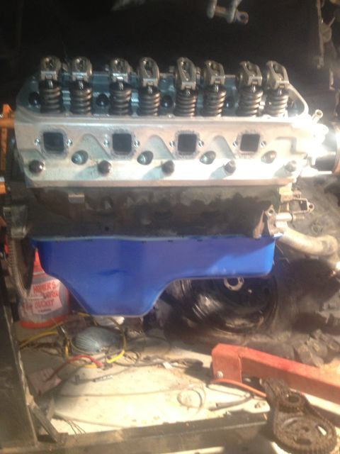 1992 Ford Bronco - Engine components are visible, including the valve train and oil pan, during a rebuild process.