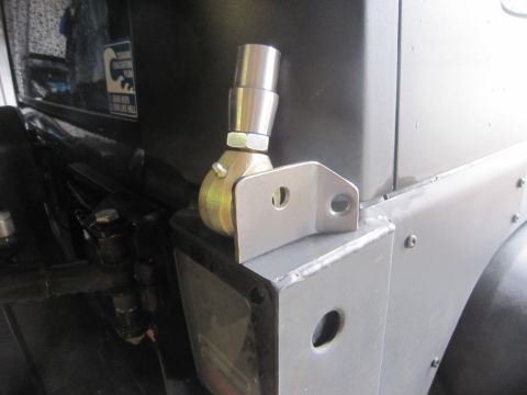 2008 Jeep Wrangler - Close-up of a custom metal bracket and joint assembly mounted on a vehicle's exterior panel.