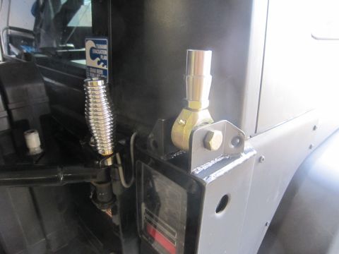 2008 Jeep Wrangler - Close-up of a custom antenna mount on the rear corner of a Jeep Wrangler, with a tsunami evacuation sticker visible.