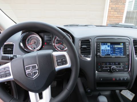 2012 Dodge Durango - The interior of a 2012 Dodge Durango showcases its dashboard, steering wheel, and central infotainment system.
