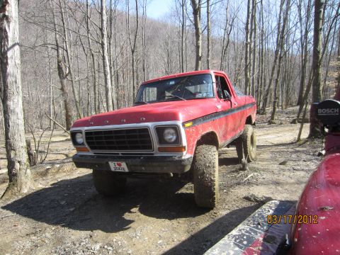 1979 Ford Bronco - This red 1979 Ford Bronco is equipped for off-road adventures with its lifted suspension and large tires.