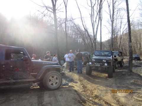 1979 Ford Bronco - A group of off-road enthusiasts gather with their Jeeps on a trail.