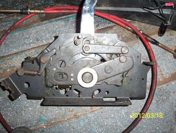 Automatic transmission shifter mechanism with red cables and metal levers