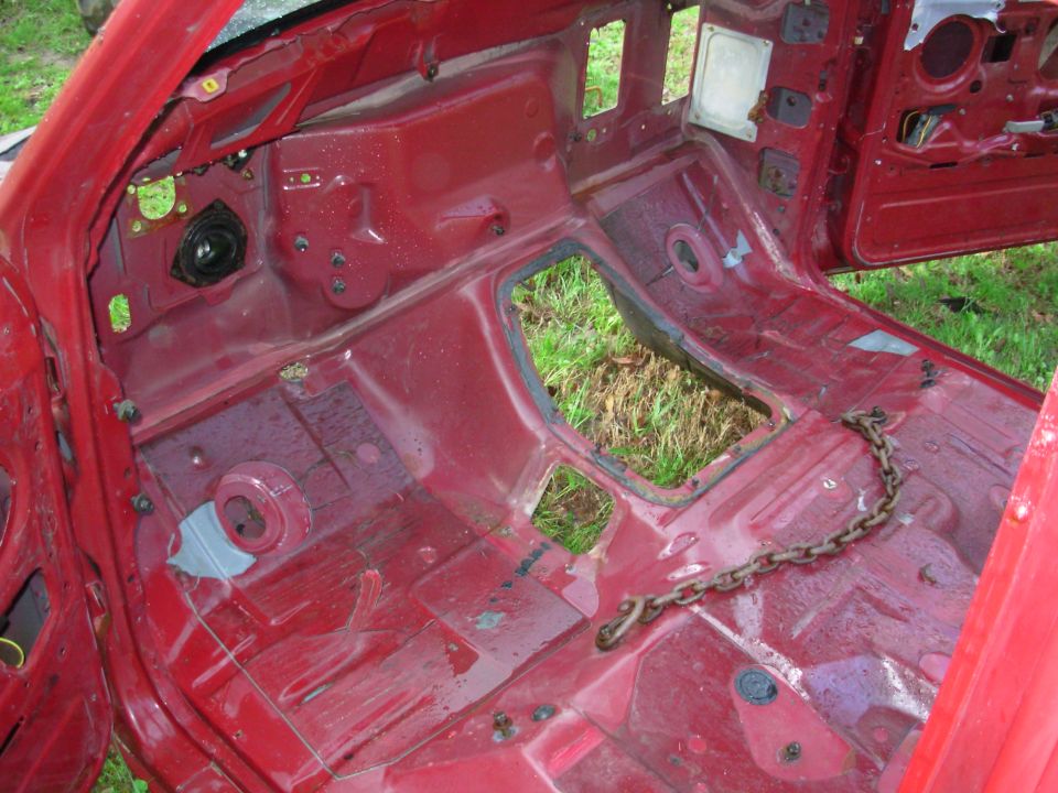 I hadn't planned on blasting the body yet, but I was already wet & filthy, so I shot it.  A lot of the matting lifted, but I haven't peeled it up yet.  I guess I'll replace it with Peel-N-Seal roofing.