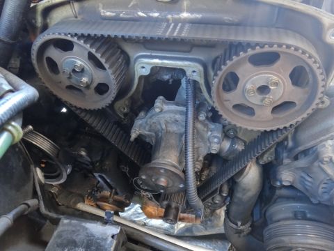 1993 Ford Taurus - Close-up view of the engine's timing belt and water pump system.