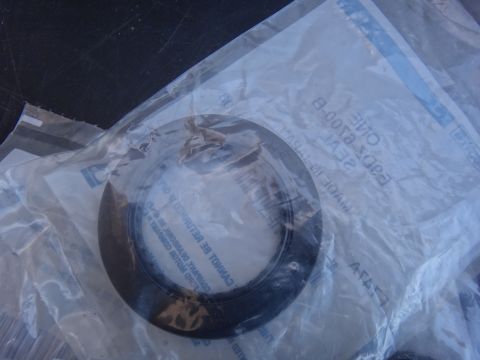 1993 Ford Taurus - A seal is shown inside its plastic packaging, with some text visible on the packaging.