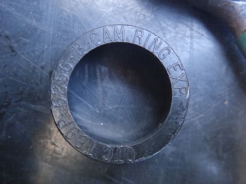 1993 Ford Taurus - A black cam ring with embossed text is shown against a metallic background.