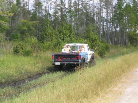 1991 Ford Bronco - This 1991 Ford pickup truck appears to be stuck in the mud while driving off-road.